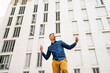 © VITTA GALLERY/Westend61 - Man dancing against white building