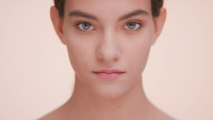 close-up beauty portrait of young brunette woman with a perfect skin. beauty model raise her face an