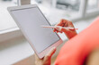 © Gustafsson/Westend61 - Businesswoman using digital tablet in office