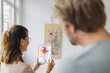 © Gustafsson/Westend61 - Woman and man using digital tablet in art gallery