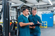 © Daniel Ingold/Westend61 - Male colleagues discussing over document while working in factory