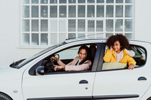 Portrait Of Mother And Daughter In White Car