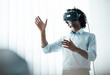 © Joseffson/Westend61 - Young businessman wearing virtual reality headset while gesturing in board room at office
