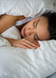 © Tetra Images/Tetra Images - Woman sleeping in bed