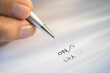 © Tetra Images/Tetra Images - Close-up of hand filling out form