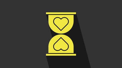 Poster - Yellow Heart in the center old hourglass icon isolated on grey background. Valentines day. 4K Video motion graphic animation