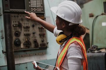 Two workers at an industrial plant. working together manufacturing activities.. worker and engineer under inspection and checking production process on factory