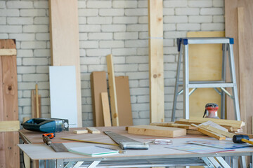 Carpenter room with several kind of woods and tools on table