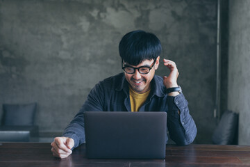 asian man work using computer hand typing laptop keyboard contact us.student study learning education online.adult professional people chatting search at office.concept for technology device business