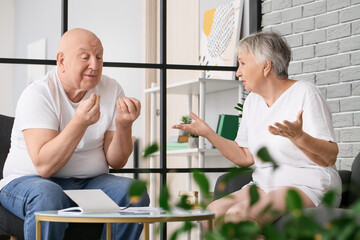 Sticker - Stressed senior couple in debt at home