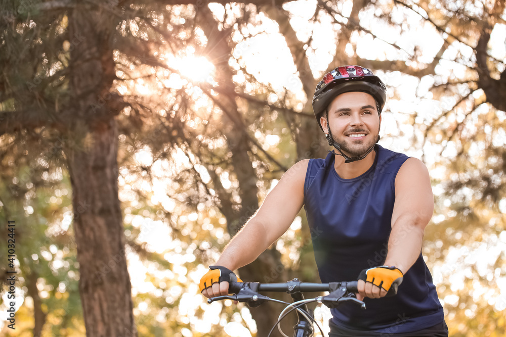 Male cyclist riding bicycle outdoors