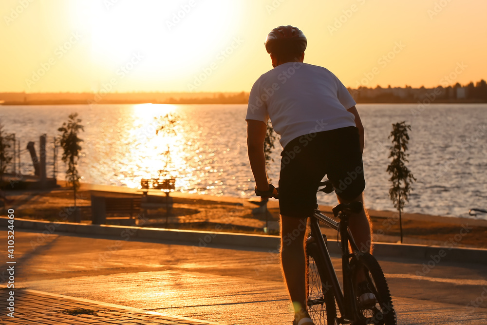 Male cyclist riding bicycle outdoors
