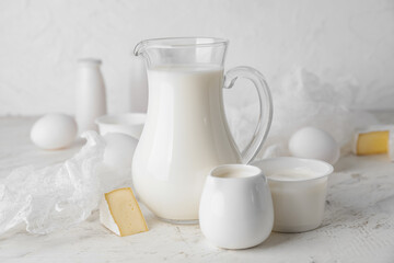 Different dairy products on light background