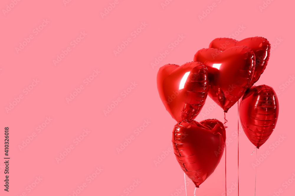 Heart shaped air balloons on color background