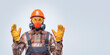 © Sergey - Personal protective equipment. Banner with professional builder in safety equipment against gray background.