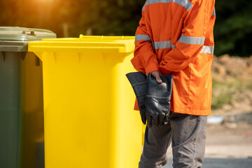 Wall Mural - Garbage collection worker with Garbage collection truck working for a public utility.