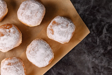 Wall Mural - Top view of 'Berliner Pfannkuchen', a traditional German donut like dessert filled with jam made from sweet yeast dough fried in fat