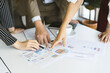 © KMPZZZ - Hand of team, group young businessman,businesswoman people working marketing plan,discussing on paperwork with teamwork,colleagues at office,workplace.Brainstorm business concept.