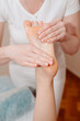 © Vladimir_Ya - Foot massage, masseuse massages female foot