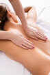 © LIGHTFIELD STUDIOS - masseur massaging young client lying on massage table