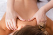 © LIGHTFIELD STUDIOS - cropped view of masseur massaging client on blurred foreground