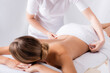 © LIGHTFIELD STUDIOS - cropped view of masseur adjusting towel on client lying on massage table