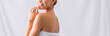 © LIGHTFIELD STUDIOS - partial view of cheerful young woman touching lips and smiling on white, banner