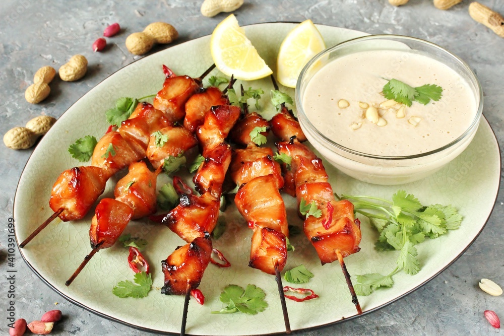 Chicken Satay with peanut sauce. Grilled chicken skewers served with ...
