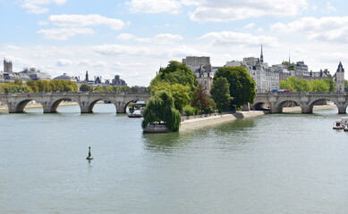 View of Seine River, Pont Neuf, Ile de la Cite and Square du Vert-Galant from Pont des Arts. Paris, France.