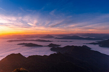 Wall Mural - Landscape and starscape of the mountain and sea of mist in winter sunrise view from top of Phu Chi Dao mountain , Chiang Rai, Thailand