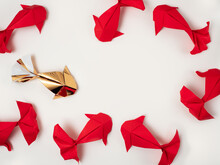 Gold And Red Paper Origami Koi Carp Fishes On A Cream Background. Eight Lucky Fish.  Simple Top Down Flat Lay