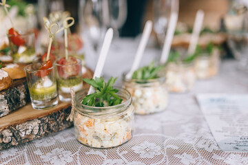 Beautifully decorated catering banquet table with different food snacks and appetizers on corporate christmas birthday party event or wedding celebration