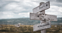 Dont Go Backwards Text Engraved On Wooden Signpost Outdoors In Nature. Panorama Format.