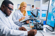 © Acronym - Professional team of scientists is working on a vaccine in a modern scientific research laboratory. Genetic engineer workplace. Future technology and science.