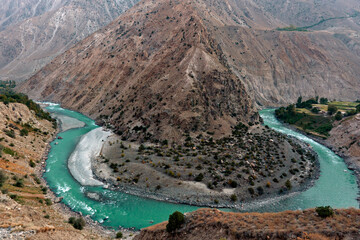  landscapes with mountains , trees and clouds from Karakorum and Himalayan range gilgit Baltistan northern areas of Pakistan