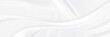 White gray satin texture that is white silver fabric silk panorama background with beautiful soft blur pattern natural.