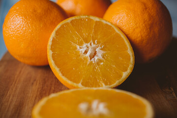 Wall Mural - Ripe oranges on wooden background. organic fruit. 