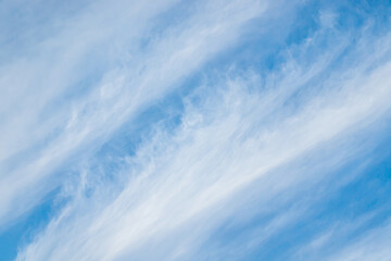 Wall Mural - White clouds against the blue sky.