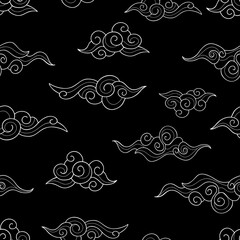 decorative asian white clouds on a black background. seamless nature doodle pattern. suitable for pa