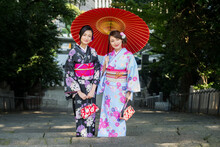 Japanese Women With Kimono Walking In Tokyo