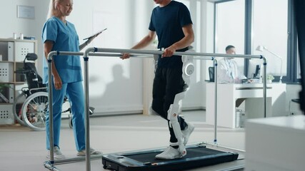 Wall Mural - Modern Hospital Physical Therapy: Doctor Uses Tablet Computer, Helps Disabled Patient with Injury Walk on Treadmill Wearing Advanced Robotic Exoskeleton Legs. Physiotherapy Rehabilitation Technology
