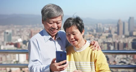 Wall Mural - asian elder couple use smartphone