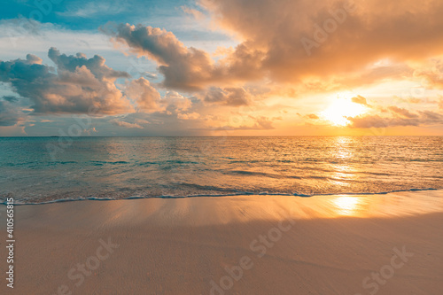 Fototapeta na szkło Closeup sea sand beach. Panoramic beach landscape. Inspire tropical beach seascape horizon. Orange and golden sunset sky calmness tranquil relaxing sunlight summer mood. Vacation travel holiday banner