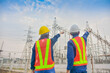 © Suriyo - Asian Engineer Man and Women working on site power plant electric system to safety work