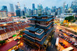 Buddha Toothe Relic Temple in Chinatown with Singapore`s business district in the background.