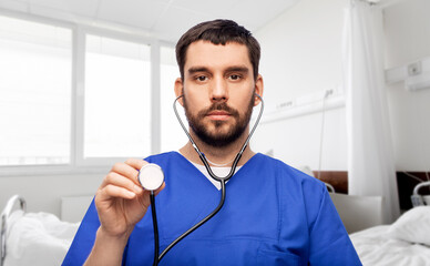 Sticker - healthcare, profession and medicine concept - doctor or male nurse in blue uniform with stethoscope over hospital ward on background