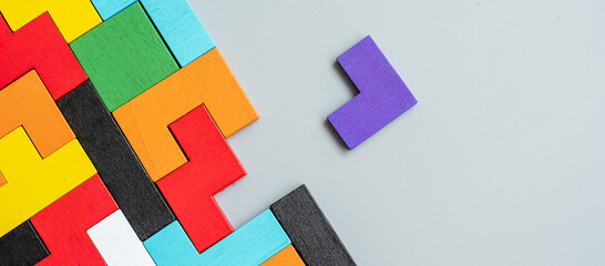 geometric shape block with colorful wood puzzle piece background. logical thinking, business logic, 