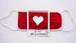 medical red mask with white heart in the middle of picture frame with word be my valentine on white background