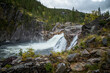 Hyttfossen waterfall in autumnal scenery