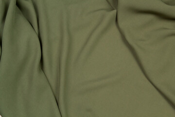 Fabric satin silk drapery. Green textile	

